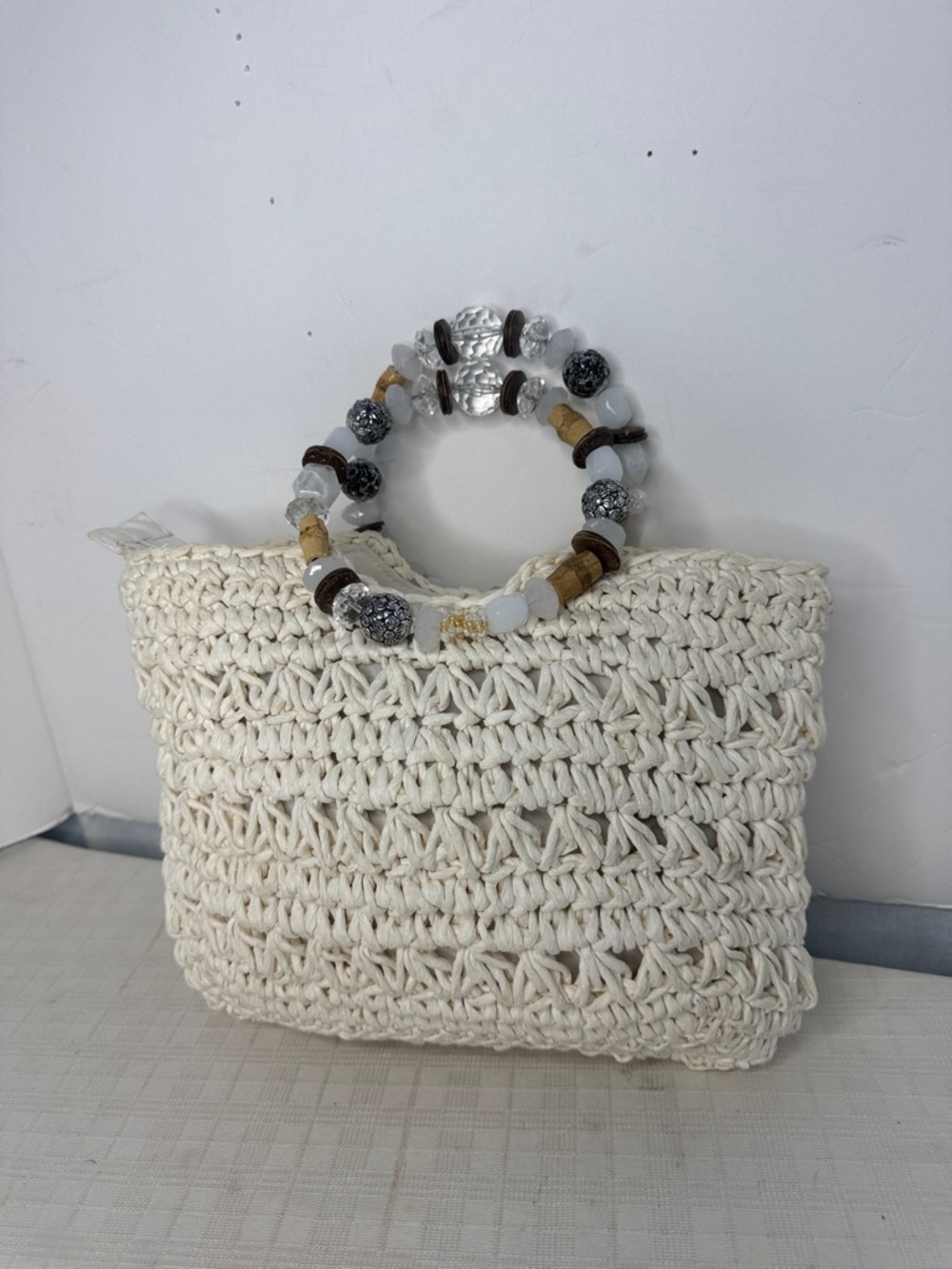 Capelli Straworld Inc. cream crochet bag with a beaded top